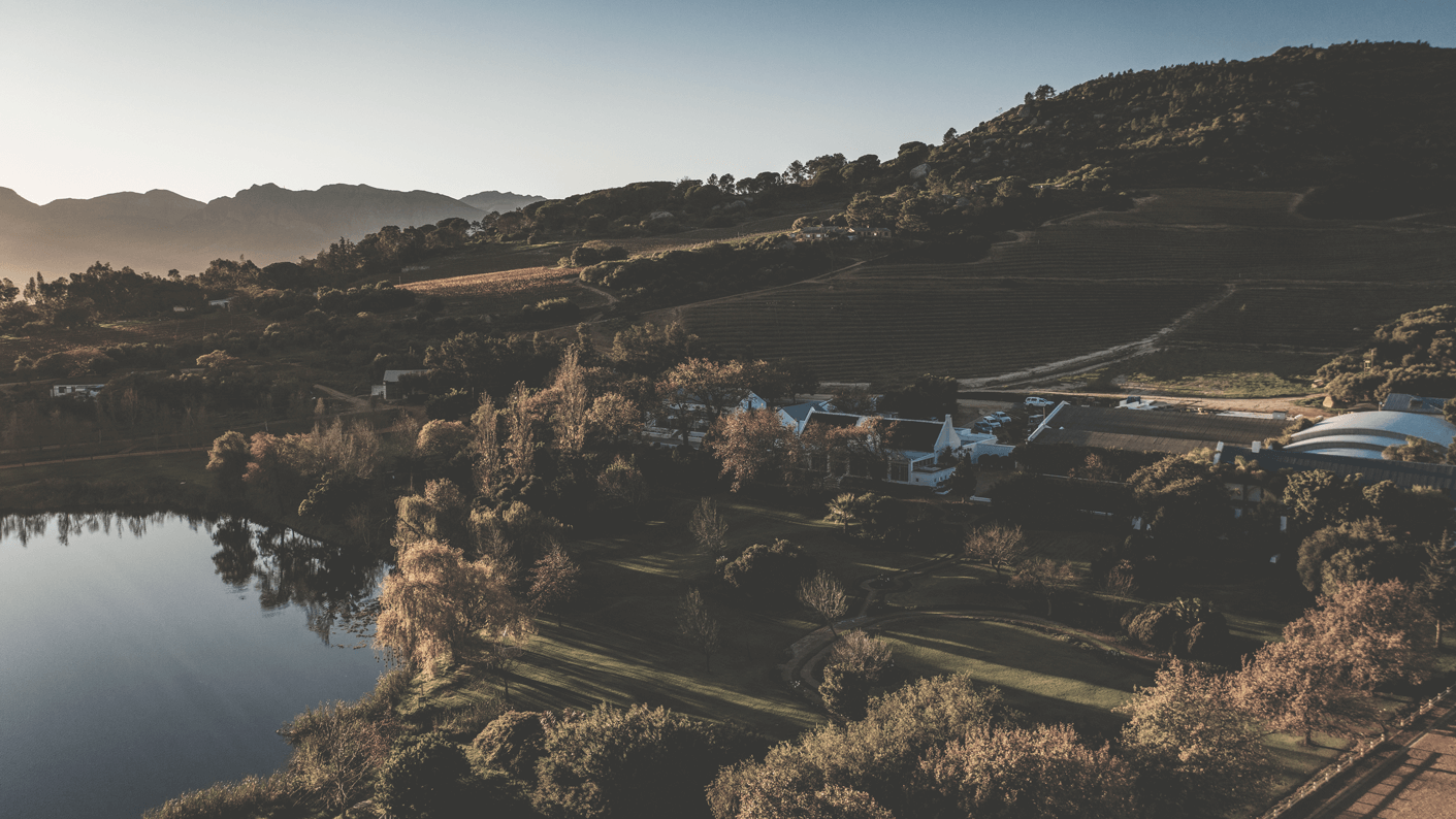 rhebokskloof-Hospitality-lawn-and-dam-view-16-9